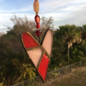 Stained glass patchwork heart sun catcher.